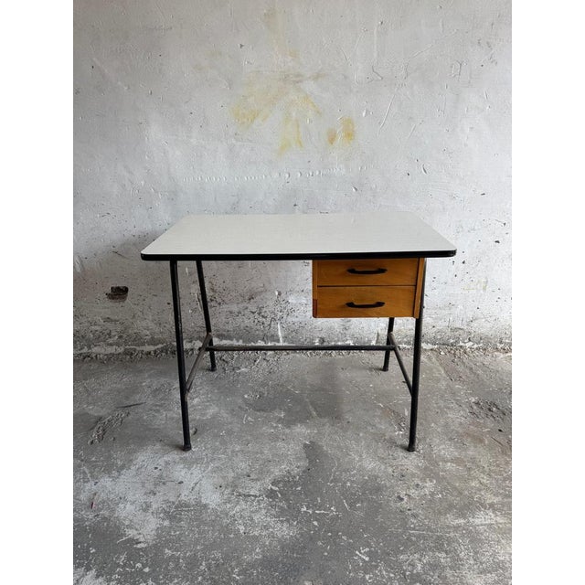 Mid-century industrial desk with two drawers a minimalist mid-century industrial desk combining functional design and...