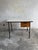 Mid-century industrial desk with two drawers a minimalist mid-century industrial desk combining functional design and...