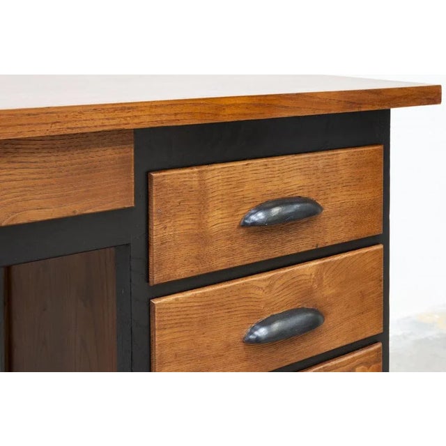 1940s oak desk, completely restored Black color and exposed natural wood parts The drawers have been lined internally with...