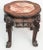 With carved foo dog elements and inset rouge marble top. Excelent occasional table or for a plant. Measures 17 1/2" x 17...