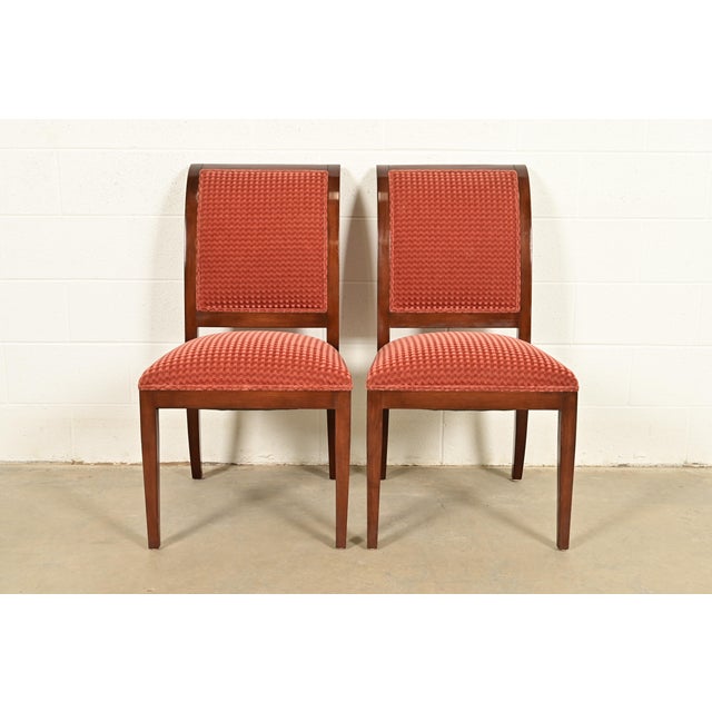 A gorgeous pair of Regency style side chairs or dining chairs By Smith & Watson USA, Circa Late 20th Century Carved...
