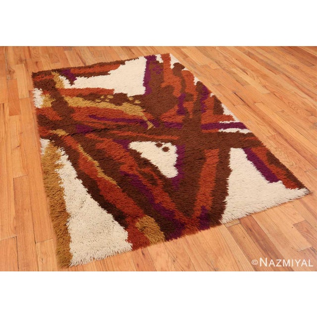 Abstract figures with a geometric structure and crystalline form decorate the marvelously textural field of this vintage...