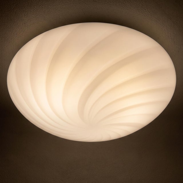 Bright and refined ceiling or wall light in fine white blown glass with a swirl pattern, attributed to Murano and dating...