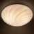 Bright and refined ceiling or wall light in fine white blown glass with a swirl pattern, attributed to Murano and dating...