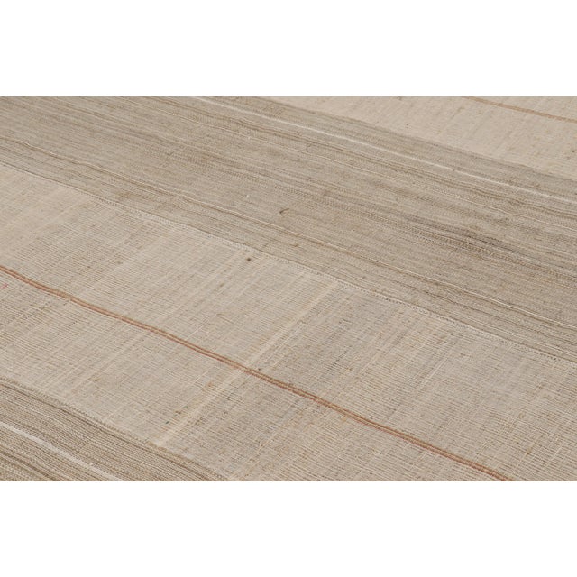 Handwoven in wool connoting mid-century panel weaving, a 14x20 vintage kilim rug originating from Turkey circa 1950-1960....