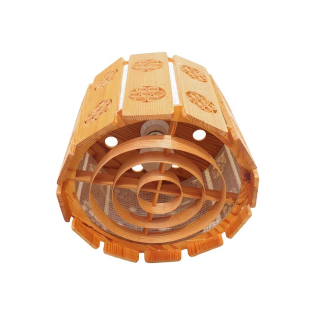 Vintage mid-century pinewood pendant lamp handmade in Sweden. Excellent vintage condition. Features new wiring for North...