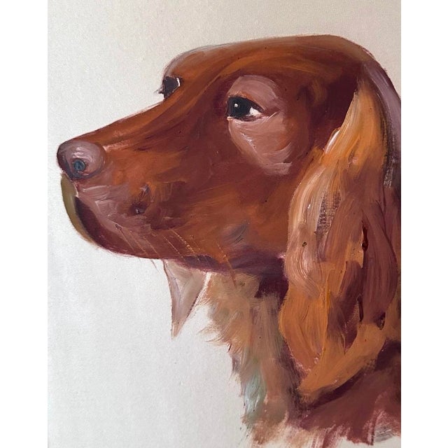 A vintage, birdseye maple framed painting. Features an Irish Setter in profile. Original artwork painted on silk. Housed...