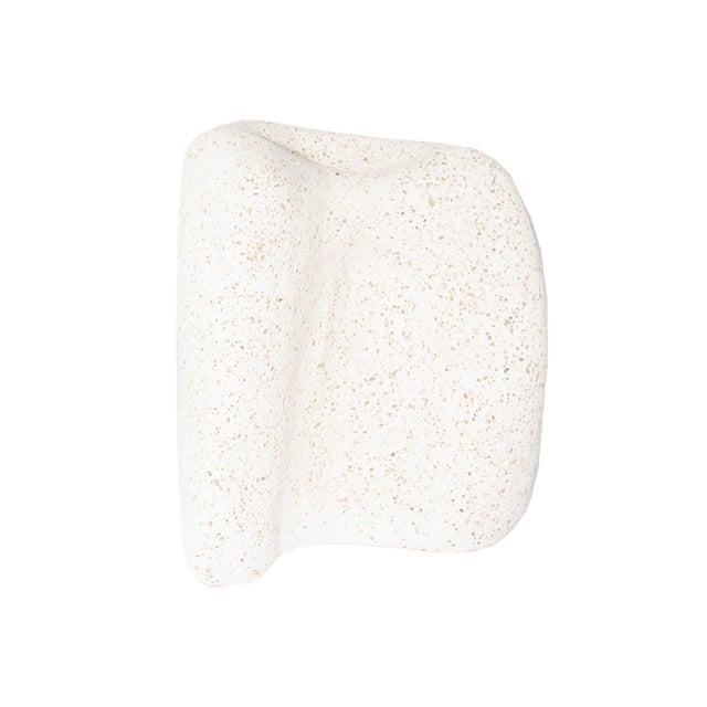 A white ceramic sculpture by American artist Lillian Harrington. This biomorphic piece is asymmetric with undulating sides...