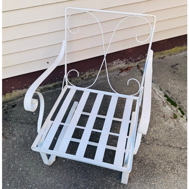 Vintage 1960s White Wrought Iron Cantilever Lounge Chair A striking example of mid-century modern design, this vintage...
