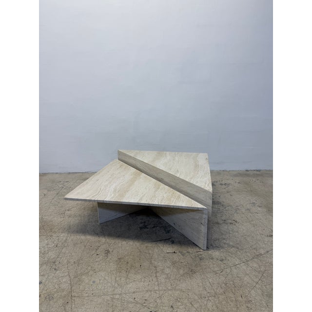Two piece triangle polished travertine marble coffee tables by Stone International, Italy 1970s. Large: W55” D27.5”...