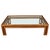 A Billy Baldwin style glass top coffee table with oak base in an open grid design. This modern cocktail table showcases a...