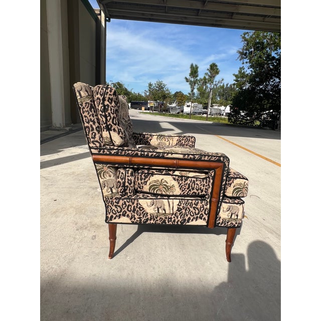 A timeless French Chippendale style armchair lounge from a 1980s collection Its well proportioned, walnut toned faux...