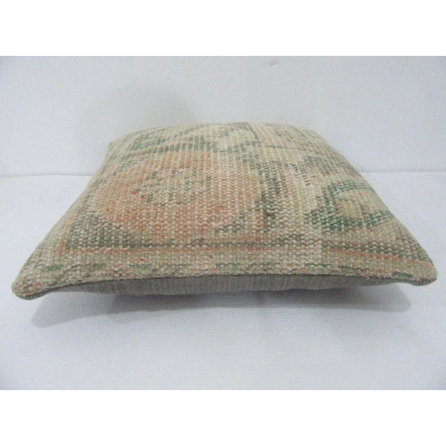 Decorative pillow cover made from a vintage Turkish handknotted rug. Backed with good quality cotton fabric. Pillow...