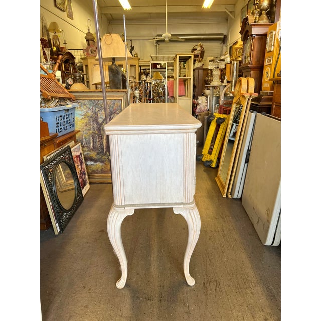 Vintage white wash wood console cabinet with Queen Anne legs. This would be great in a large entry way or as a side table...