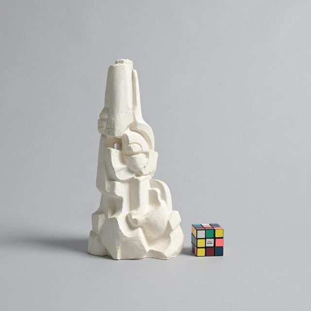 This abstract sculpture in plaster was made by the Belgian artist Jan Keustermans. The sculpture has a rough plaster...