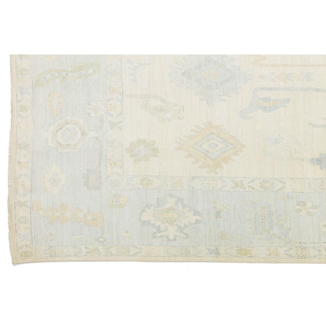 Artisanal Oushak Style Wool Area Rug: Neutral Ivory With Muted Floral Motifs For Sale - Image 9 of 11