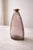 Handblown amethyst studio glass bottle sculpture with original cork — heavy, modern, sculptural, and beautifully organic....