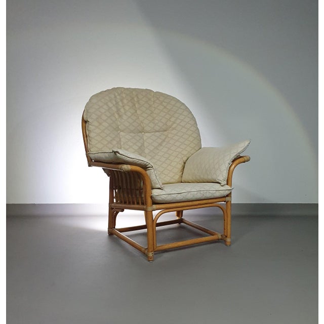 Oversized rattan / bamboo lounge chair with original cushions. 1970s Width 100 Depth 85 Height 105 Seat height 43 Seat...