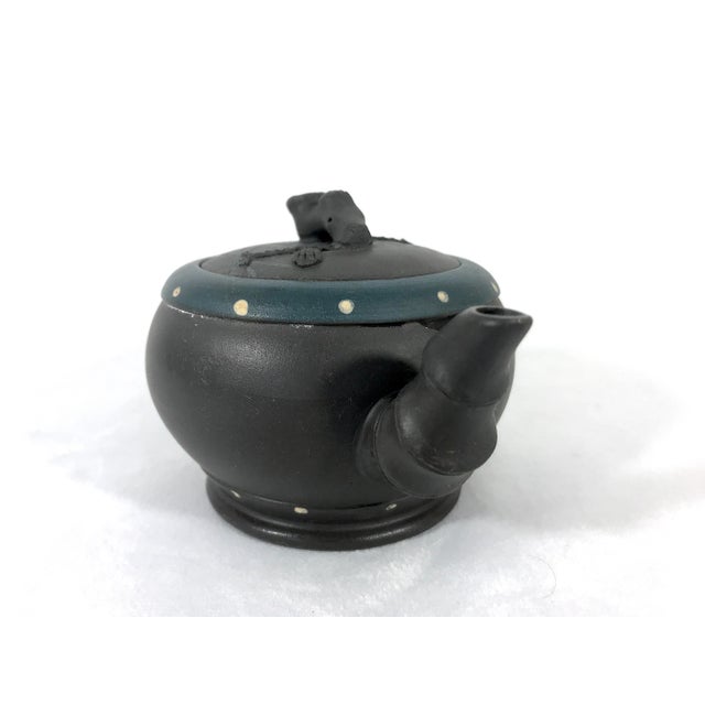 A delightful little signed and chopped Yixing Zisha teapot topped with pine needles and lotus seed pod. Very detailed...
