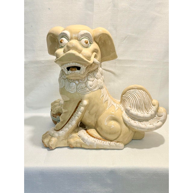 Whimsical, regal, and impressive in scale, this Turtle and Crane find is a monumental Circa 1980s ceramic Foo Dog...