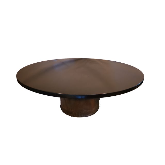 This is a gorgeous "Ebonized" walnut dining table with a 2" thick, dark grained top and a custom industrial steel base....