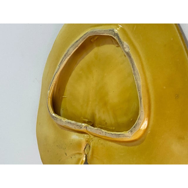 This Trivet, is in Glazed Terracotta. The color are yellow and green. This has been done in 1910, in France.