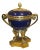 A Sevres style gilt bronze-mounted porcelain cachepot of ovoid form with a monochrome cobalt finish raised on four paw...