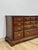 This handsome vintage American Drew nine drawer lowboy dresser is a well-crafted and generously proportioned bedroom...