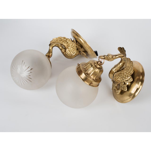 1950s Spanish Empire Chased Brass Swan Wall Sconces With Starburst Frosted Globes - A Pair For Sale - Image 4 of 13