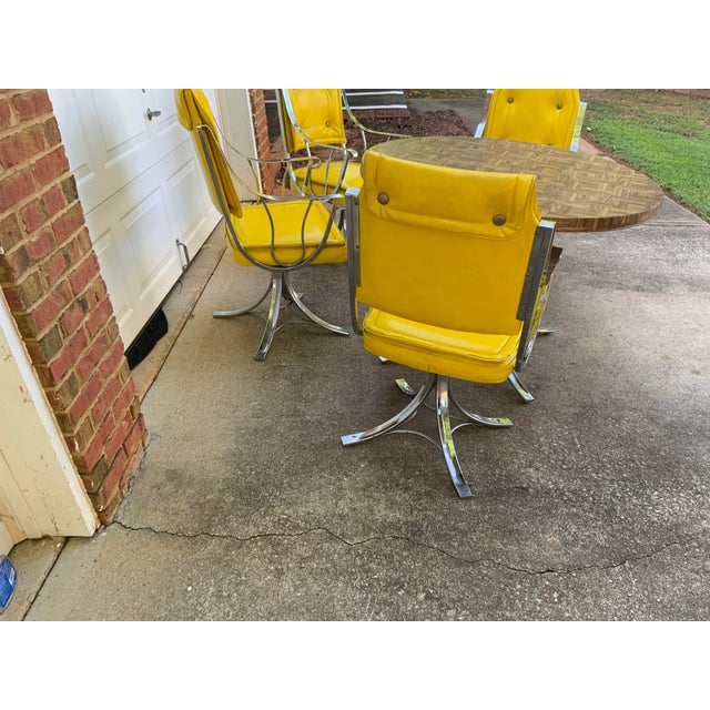 beautiful mid century set of vintage dining four chairs and table with chromes and yellow vinyls very unique