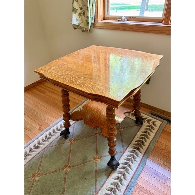 This is a gorgeous antique parlor or lamp table, dating from the late 19th or early 20th century. It is made of solid...