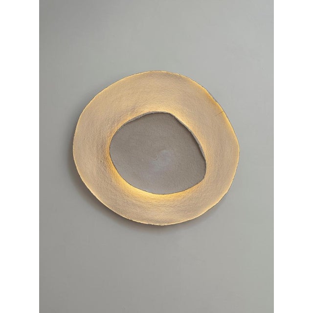 Bone #17 wall light by margaux leycuras one of a kind, signed and numbered dimensions: ø58, h54 cm material: ceramic, sand...
