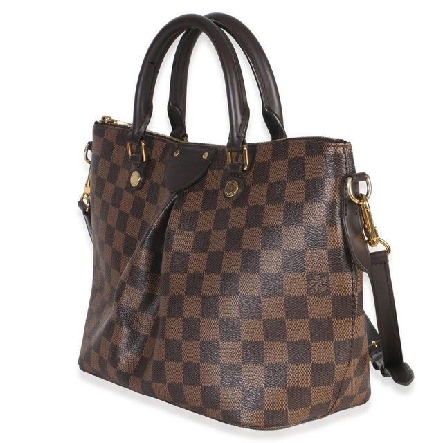 Item #: 152359 Interior Material: Fabric Size: PM Features Interior: Three slip pockets. Dimensions: 9.75 x 8 x 4.75 in...