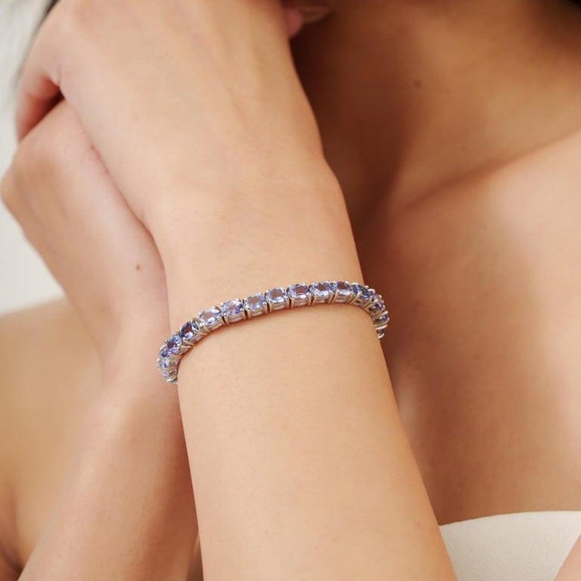 Oval Cut Tanzanite Eternity Style Tennis Bracelet in Sterling Silver For Sale - Image 4 of 11