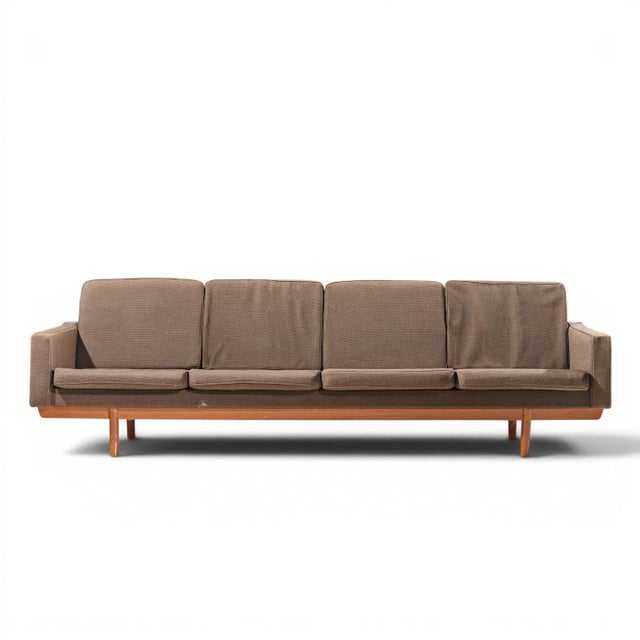 Hans Wegner Style Mid Century Danish Teak 4 Seater Sofa This sofa measures: 95.5 wide x 32 deep x 28.5 inches high, with a...