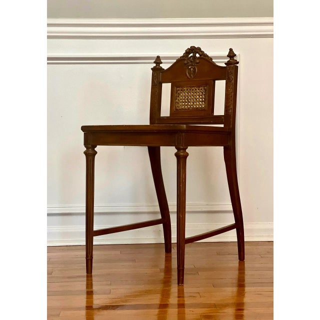 French Louis XVI style caned seat and back carved oak vanity chair. Charming chair beautifully carved with central...