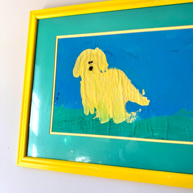 Vintage 1990s custom framed yellow dog painting with teak matting and matching yellow frame. The work is unsigned.