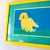 Vintage 1990s custom framed yellow dog painting with teak matting and matching yellow frame. The work is unsigned.