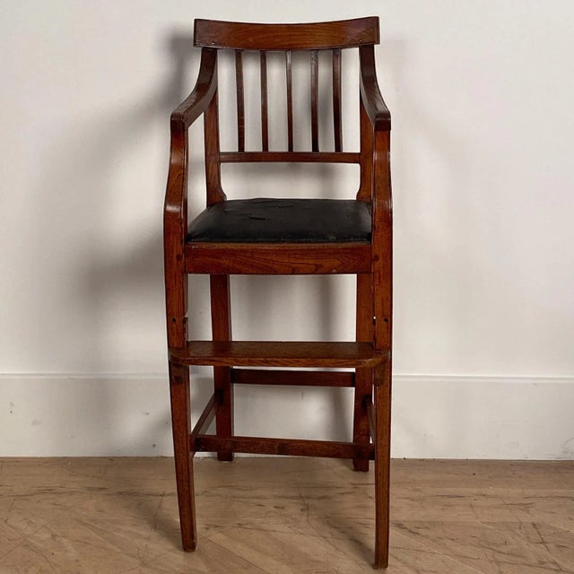 An early 19th Century Georgian English elm child's high chair