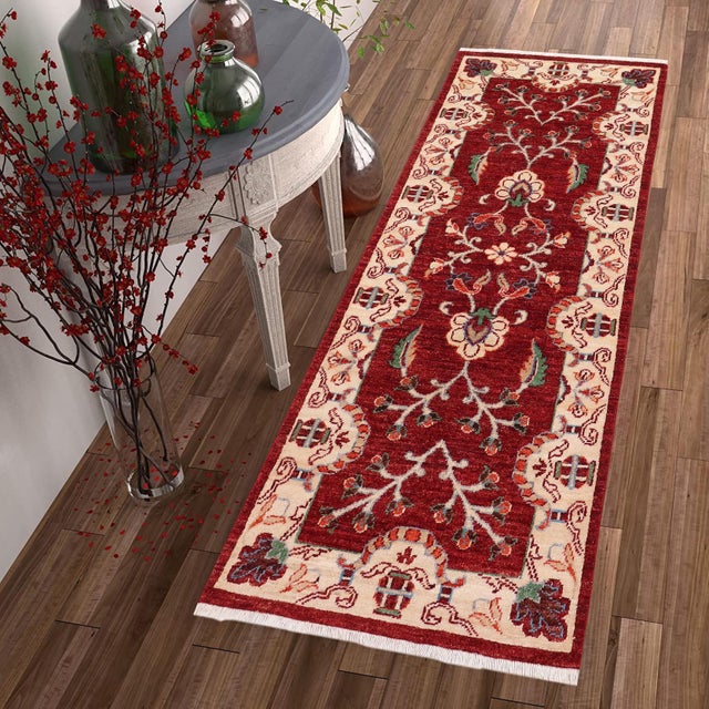 Enhance the ambiance of your home with this magnificent Persian-influenced Turkish hand-knotted rug made by skilled...