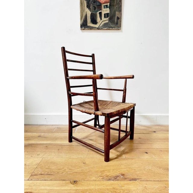 A very honest 19th century Sussex armchair. Lovely beech frame with ladder back. Sturdy and seat intact. Restorations made...