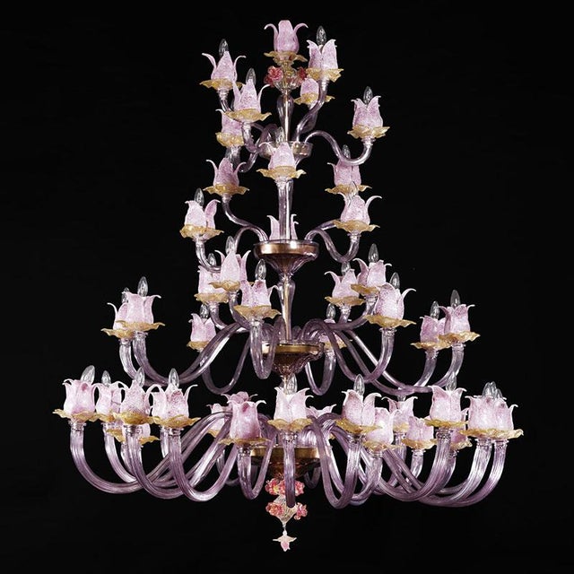 Magnolia chandelier in pink and amber murano glass, entirely handmade by murano masters. It presents a system composed of...