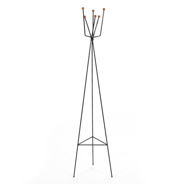 Three legs are better than four. This delightful iron coat stand has three legs which support six arms topped with wooden...