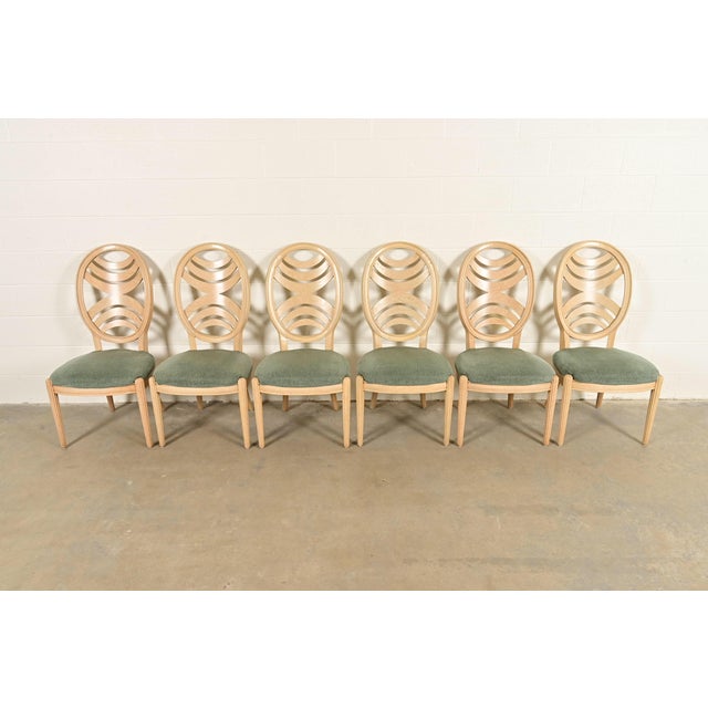 An outstanding set of six modern Art Deco style dining chairs By Henredon USA, Circa 1980s Carved pickled oak frames, with...