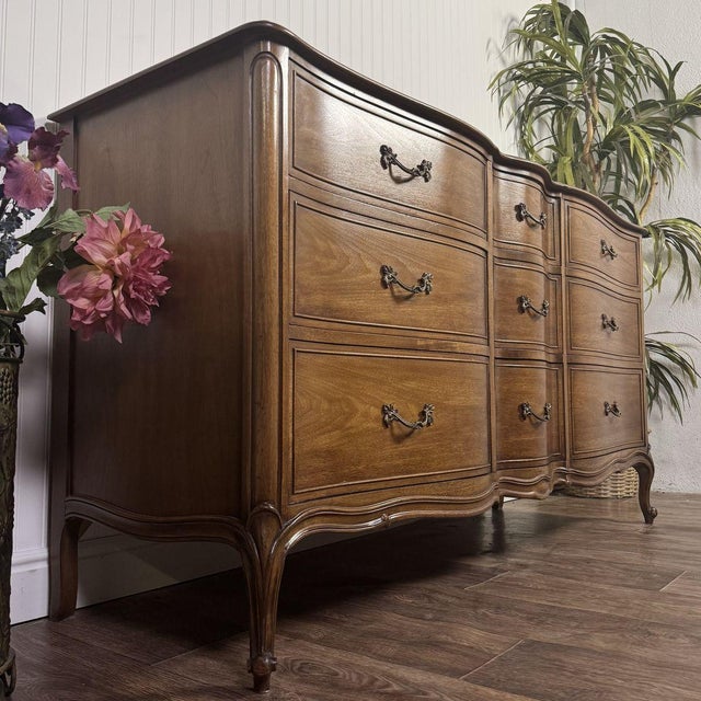 Stunning French Provincial lowboy dresser from Drexel’s coveted high-end Bordeaux collection. This piece features an...