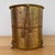 Midcentury Hollywood Regency gold tone wastebasket with rope and tassel detail and claw feet. Totally glam and a wonderful...