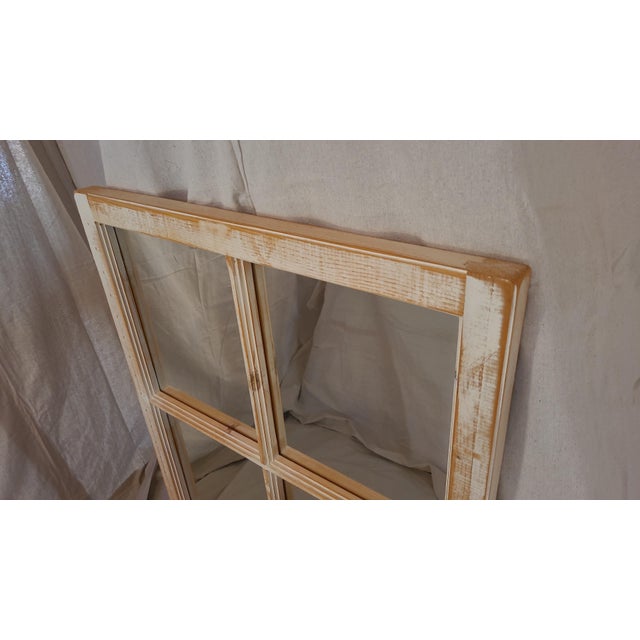 This is a beautiful, reclaimed farmhouse window frame mirror. It has a great distressed white painted finish, very sturdy....