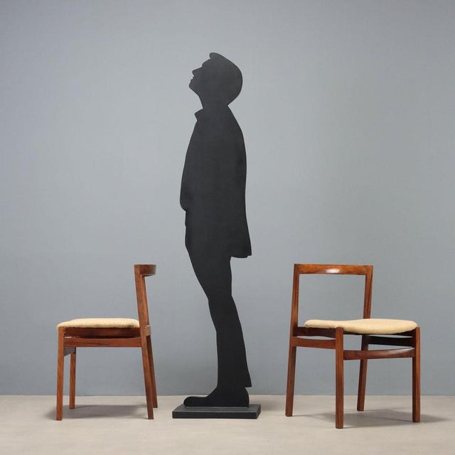 Dining chairs dating back to the 1960s, an expression of Italian craftsmanship, featuring an exotic wood frame that lends...
