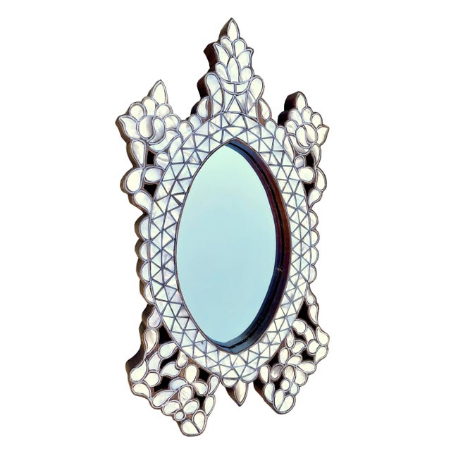 Gorgeous small hand crafted mother of pearl inlaid mirror. The oval shape frame decorated with beautiful ornate inlay...