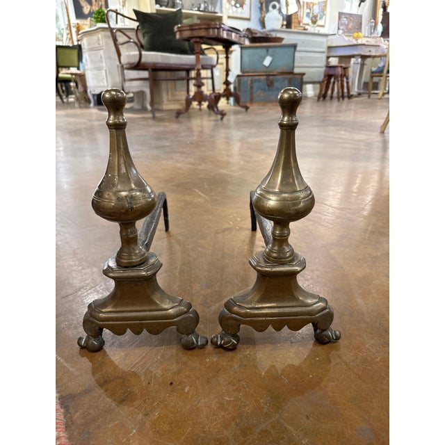 Pair of French 18th c brass andirons. 7”l x 15” d x 13”h 46-019